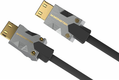 Zwei Monster Cable Products, Inc. M1000 HDMI-Kabel (1,5 Meter) mit vergoldeten Anschlüssen sind vor einem weißen Hintergrund abgebildet. Das metallisch silber-schwarze Gehäuse trägt das „MONSTER“-Logo. Diese hochwertigen schwarzen Kabel unterstützen Ultra HD 4K und HDR10 für ein außergewöhnliches Seherlebnis sowie Ethernet-Funktionen.